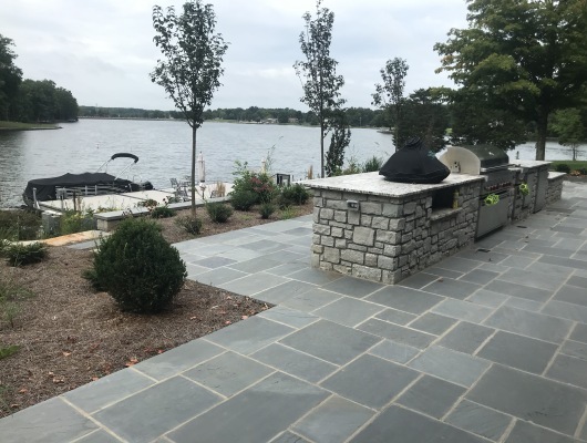 patio with grill and lake view